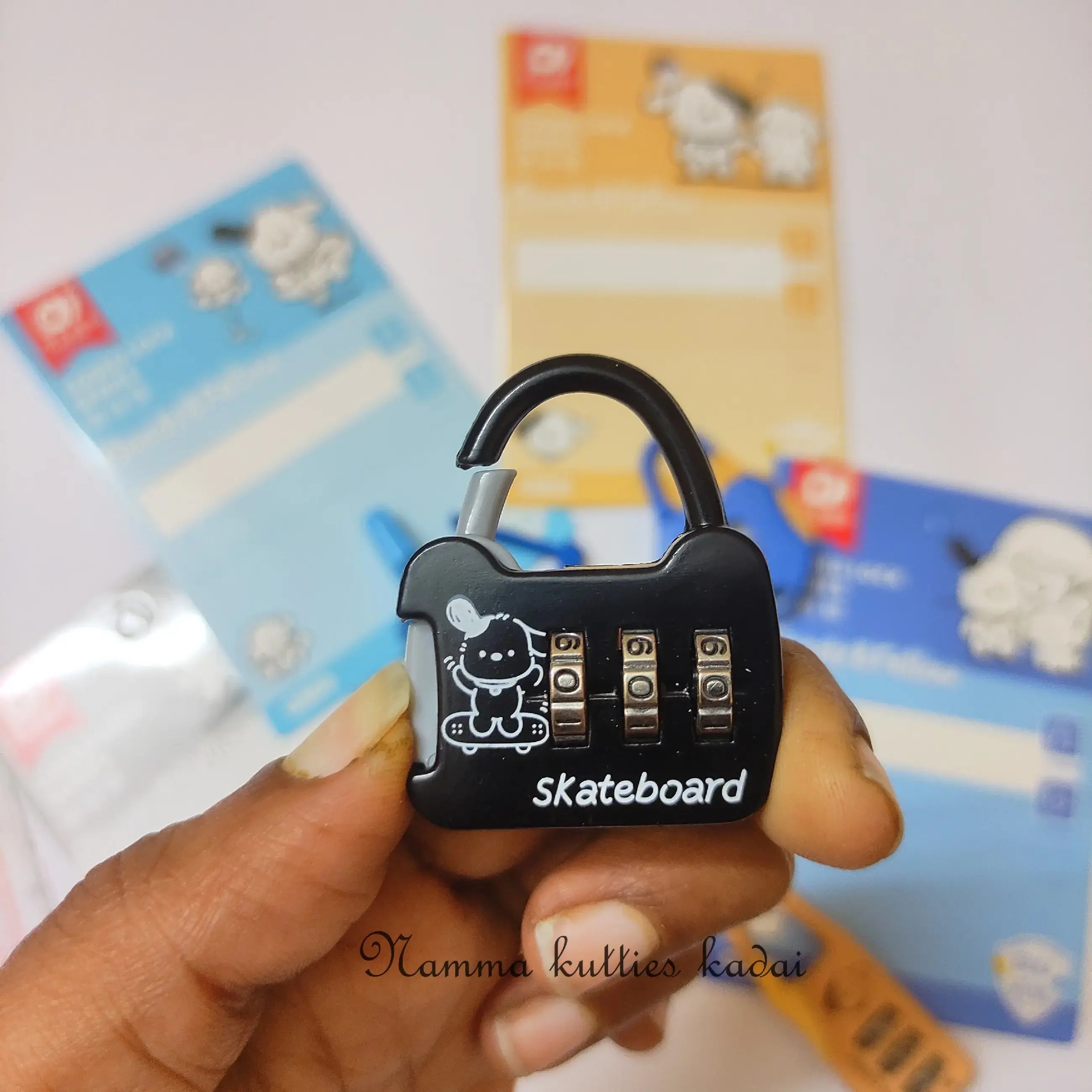 Black combination lock with 'Skateboard' text held by a hand, with colorful packages in the background.